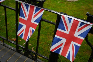 Arnot Hill Park, Nottingham, England – July 23 2025: Union Jack bunting adorning iron fence in...
