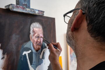 Fototapeta premium Artist in his painting studio, in Villa Giardino, Córdoba, Argentina.