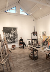 Artist in his painting studio, in Villa Giardino, Córdoba, Argentina.