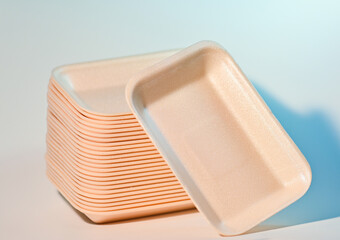 Stacked peach foam food trays for packaging and display