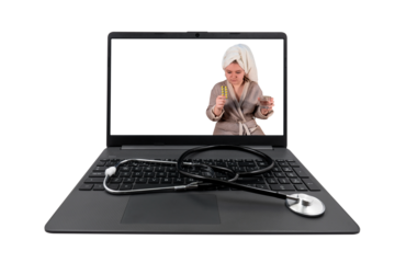 Laptop and medical stethoscope isolated on white background. On the laptop screen - a girl with cold symptoms holds a blister with pills and a glass of water