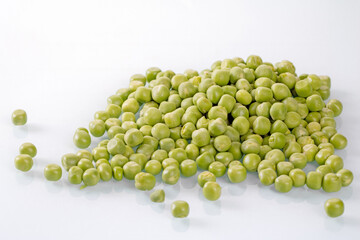 Fresh green peas bunch on white background - a vibrant, healthy food element