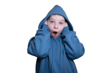 A surprised little girl in a blue hooded sweatshirt covers her ears, wide-eyed and mouth open in shock on a transparent background