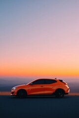 silhouette of modern electric car parked on empty road at sunset
