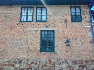 old brick wall with windows