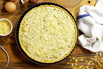 Delicious Homemade leek Quiche with Cheese on Rustic Wooden Table
