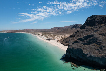 Aerial view of Balandra beach boasting turquoise water, white sand, and rocky cliffs in La Paz, Baja California Sur, Mexico