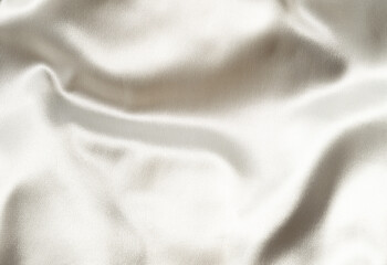 Fototapeta premium Wrinkled ivory satin fabric with soft sheen 