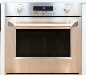 Fototapeta premium Electric oven in kitchen. Cooking appliance. Cooking in convection oven. Household appliance to cook. Baking homemade food in home kitchen. Kitchen furniture