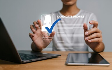 HR manager using a digital interface and laptop for candidate selection. Concept of human resources technology and recruitment process.