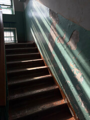 Old worn staircase in a building hallway