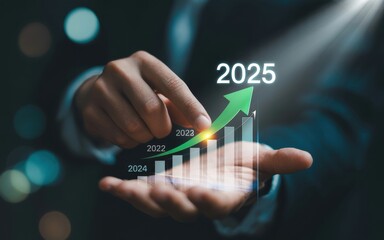 Businessman holding a virtual graph showing business growth and investment planning towards the target year 2025.