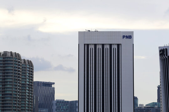 Kuala Lumpur, Malaysia - November 25, 2022: PNB (Permodalan Nasional Berhad) building, right, is seen in Kuala Lumpur's financial centre district.
