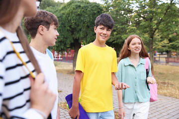 Group of teenagers spending time together outdoors