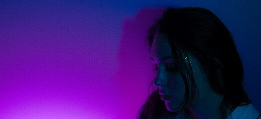 Moody Portraits of a Woman in Neon and Dramatic Lighting – Emotional Expressions in Red, Blue, and Orange Tones