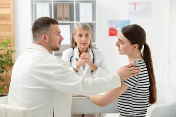 In vitro fertilization (IVF). Couple having consultation with doctor in reproductive clinic, selective focus