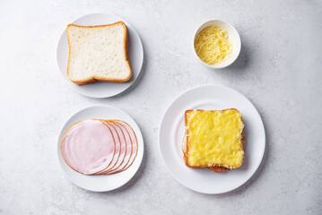 Ham cheese sandwich on a white plate