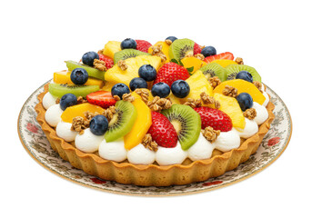 A colorful fruit tart with kiwi, strawberry, blueberry, and pineapple on a decorative plate shown on transparent background