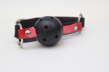sex toy gag on a white silk background