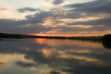 Fototapeta premium A body of water with a bridge in the background