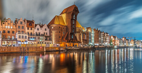Gdańsk waterfront at night with Żuraw Crane and cloudy sky © Dreamnordno