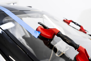Windshield removal and installation using suction lifters. Windshield replacement using lifting...