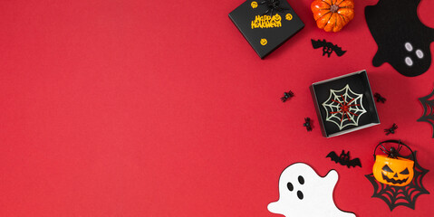 Decorative dark red Halloween background with flying cut out cute ghosts, gift, pumpkins, spiders...