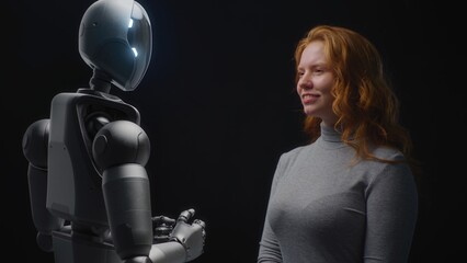 Futuristic Human-Machine Concept: Visualization of Young Woman Speaking with Advanced Humanoid...