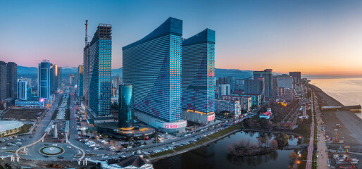 Obraz premium Modern skyline of Batumi at sunrise with beachfront and skyscrapers