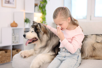 Girl suffering from allergy with her dog at home