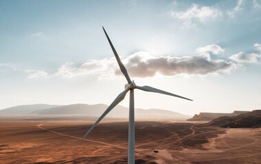 A wind turbine in a vast open desert