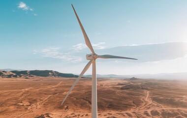 A wind turbine in a vast open desert