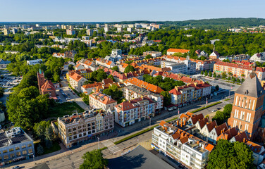 Panoramic aerial view of Koszalin historic city center with main market square and Holy Mary Immaculate Conception Catedral church in Poland © Art Media Factory