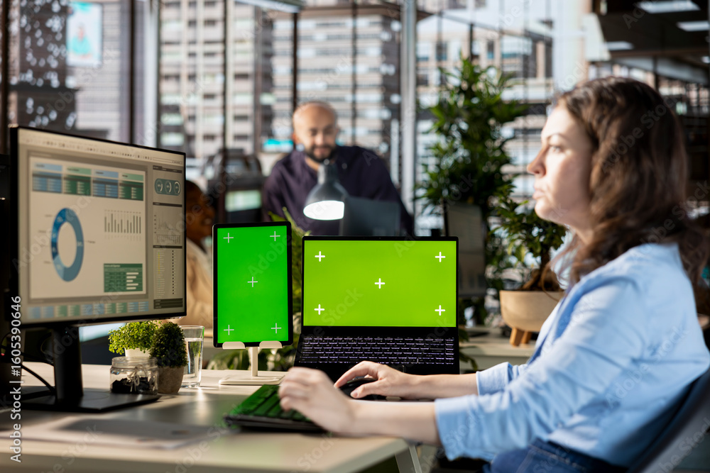 Aufkleber young manager works with infographics next to isolated display at the desk, working on enterprise so