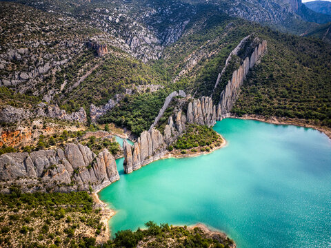Aerial View of the Wall of Finestres &ndash; Limestone Cliffs Rising from Turquoise Reservoir in Aragon, Spain
