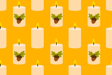 Seamless pattern with autumn candles decorated with acorns and oak leaves on yellow background
