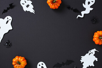 Festive Halloween border with pumpkins, ghosts, bats, and spiders framing a black background.