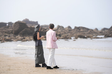 In June 2025, a Korean man and woman in their late fifties are standing and talking beside the...