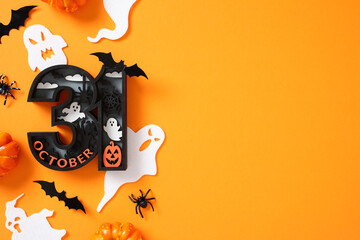 Halloween composition on orange background featuring bold 31 October with spooky element, ghosts, bats, spider webs, and pumpkins.