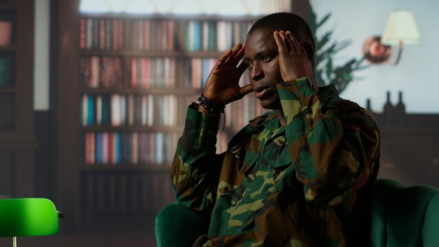 African american soldier remembering war flashbacks and dealing with a serious case of shell shock syndrome, traumatic memories. Armed forces veteran feels guilty with PTSD. Camera B.