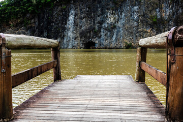 wooden pier on the edge of a lake  in Tangua Park, in city of Curitiba