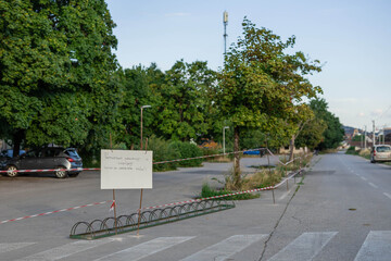 Hand written sign in slovenian prohibiting parking of cars on this parking spot around future athletic centre in ljubljana