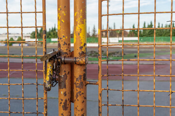Locked metal door of old athletic centre of ljubljana, ZAK, which will soon be renovated with a modern version.