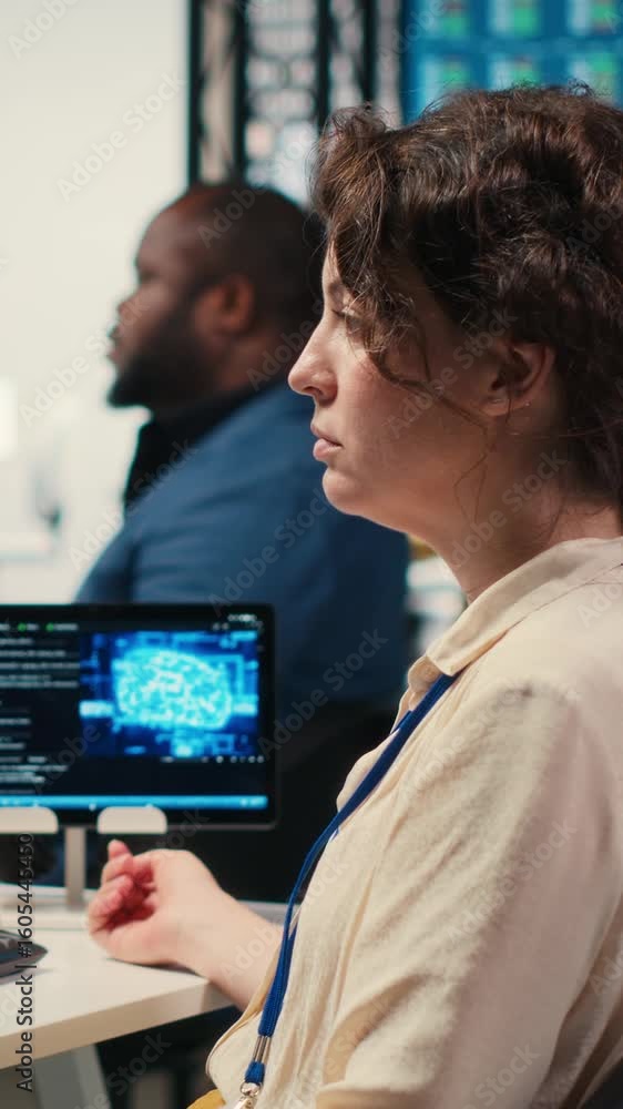 Poster vertical video office administrator checking monthly reports with ai analytics platform, employing n