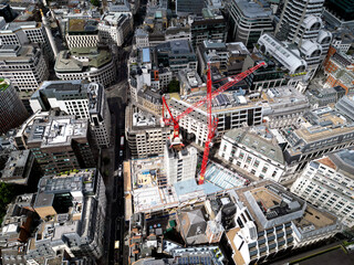 A construction site dominated by cranes, emphasizing growth and the evolution of the urban landscape in modern cities in London, UK. City of London.