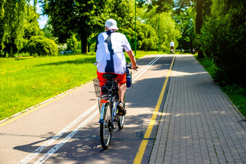 Cyclist ride on the bike path in the city Park
