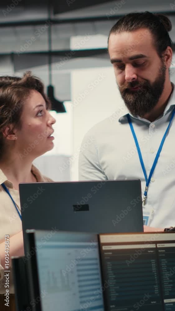 Aufkleber vertical video team of staff members work with high tech and performance metrics, aligning business 