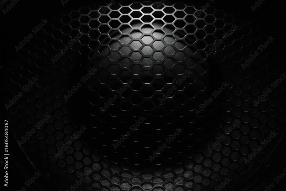 Poster close-up macro shot of a dark metallic speaker grill. hexagonal honeycomb pattern with a textured su