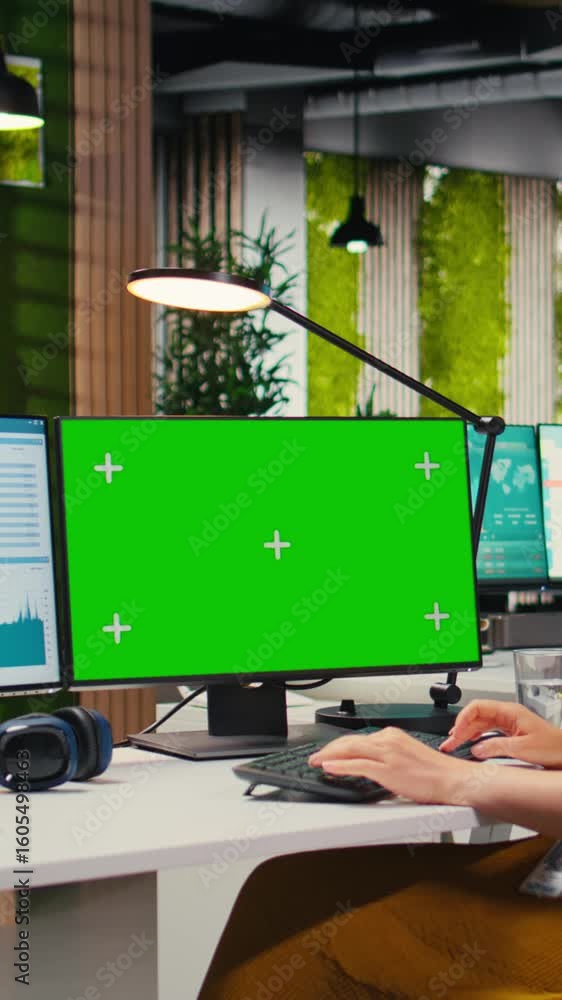 Poster vertical video executive assistant analyzing kpi metrics on computer monitor with mockup, handling t