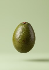 Floating avocado on pastel green background.